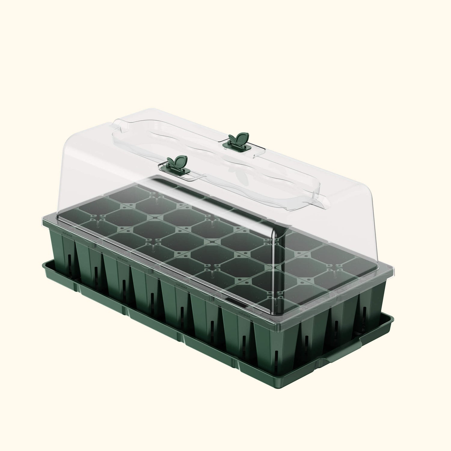 Green and clear seedling tray with lid on a white background